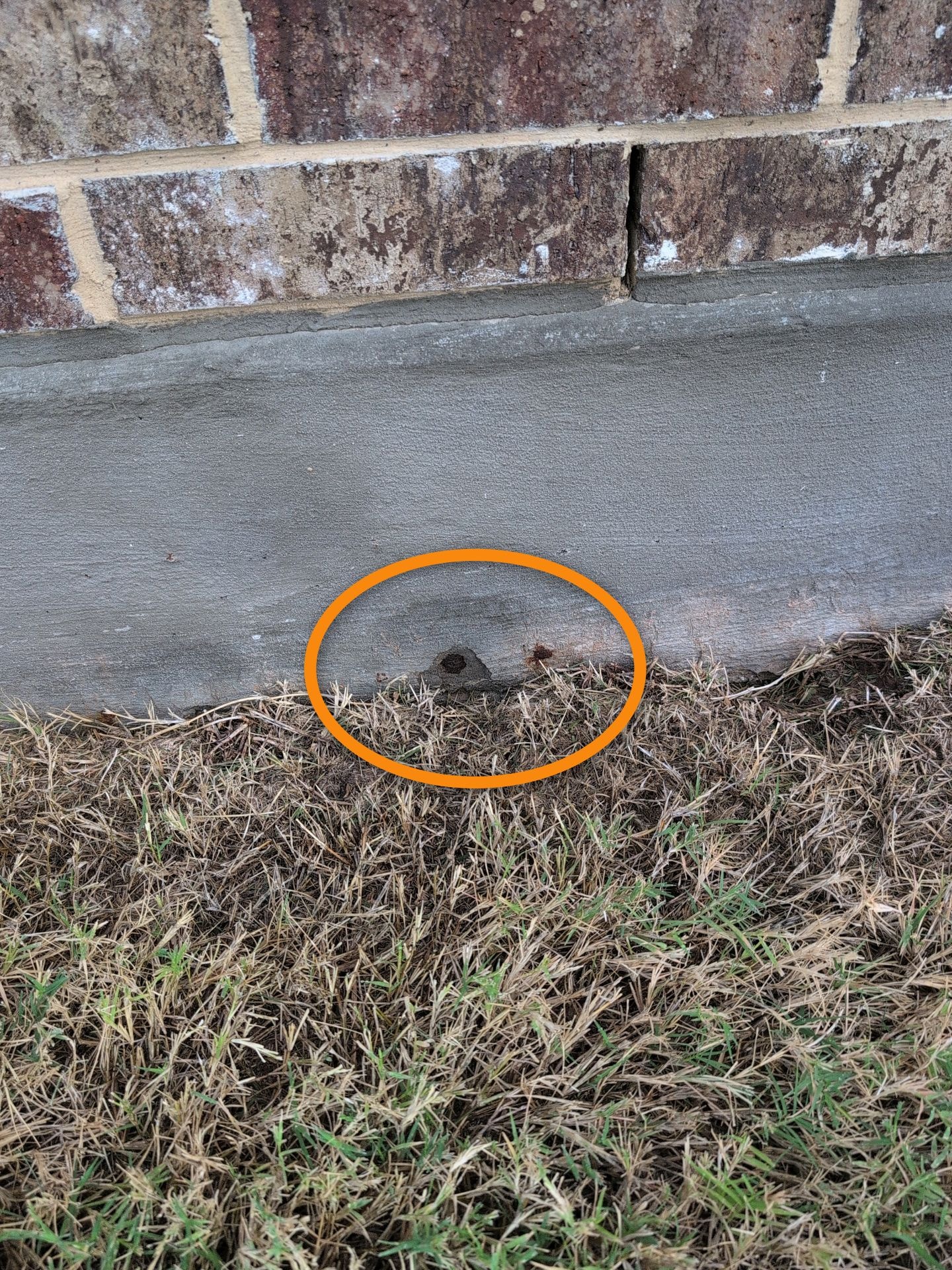 Foundation gap at brick wall base — inspection finding